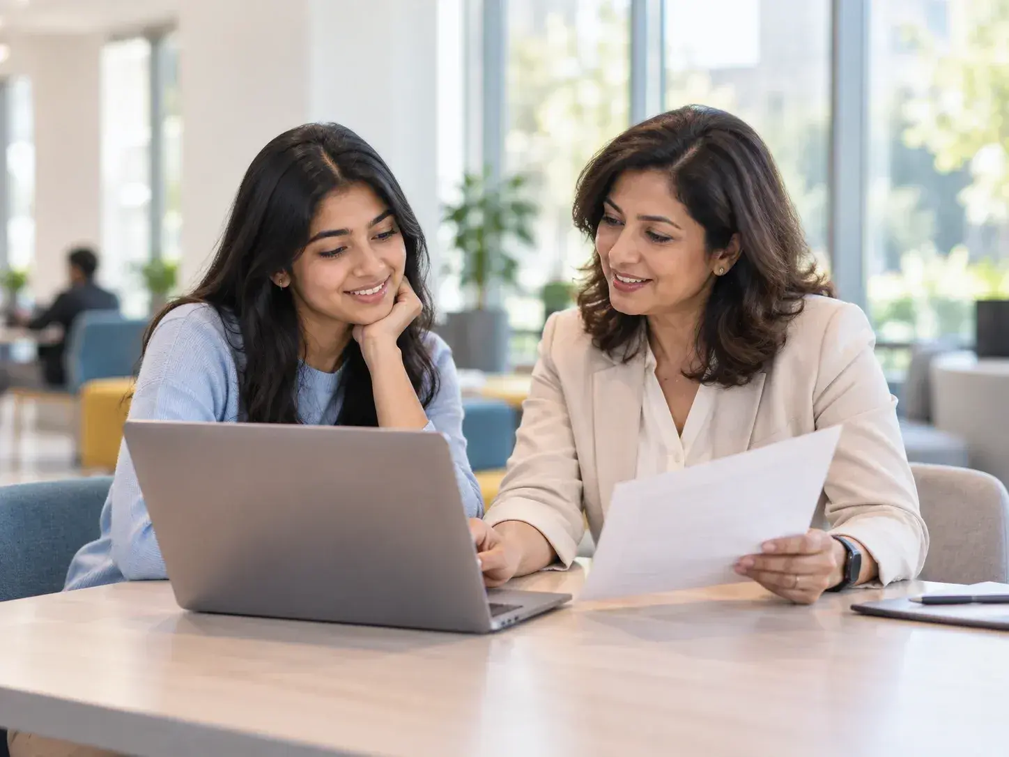 Student reviewing study and university options with an admissions adviser